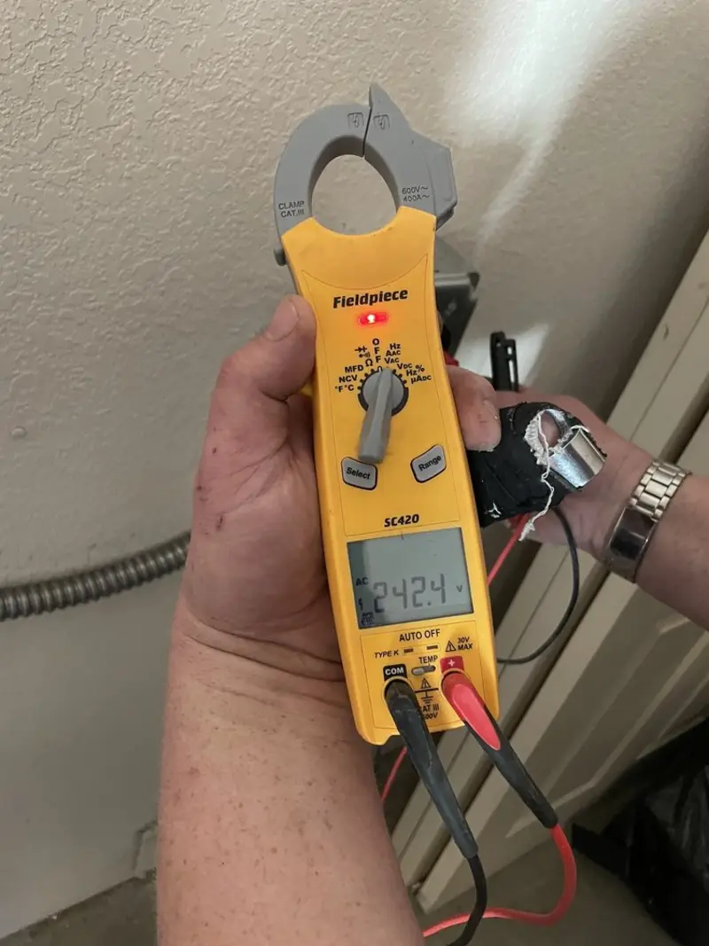 Voltage testing with clamp meter during Outlet Installation in Dumbarton